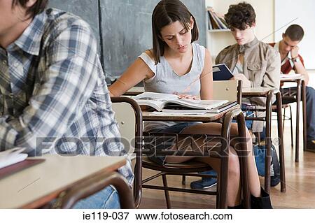 Stock Photo - Teenagers in a classroom. Fotosearch