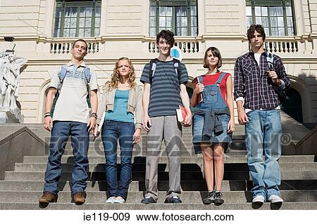 Stock Photo - Teenagers standing on college steps. Fotosearch