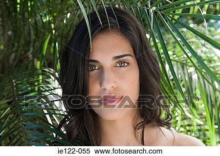 Young woman amongst leaves View Large Photo Image Stock Photography - Young woman amongst leaves. Fotosearch