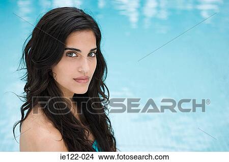Picture - Young woman swimming pool. Fotosearch