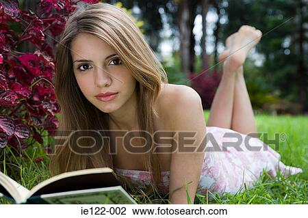 Young woman with a book View Large Photo Image Stock Image - Young woman with a book. Fotosearch