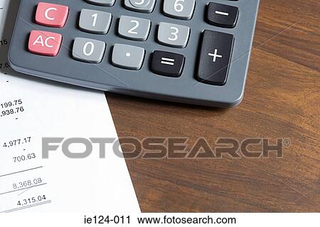 A calculator and paper work View Large Photo Image Stock Image - A calculator and paper work. Fotosearch