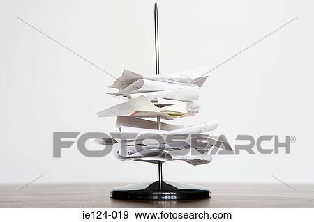 A letter spike with paper on it View Large Photo Image Stock Photo - A letter spike with paper on it. Fotosearch