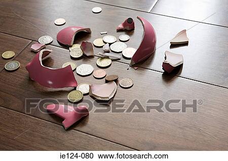 A smashed piggy bank View Large Photo Image Stock Image - A smashed piggy bank. Fotosearch