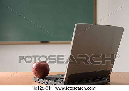 Apple and laptop View Large Photo Image Stock Image - Apple and laptop. Fotosearch