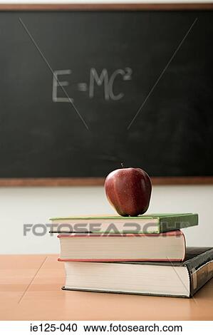 Apple on pile of books View Large Photo Image Stock Image - Apple on pile of books. Fotosearch