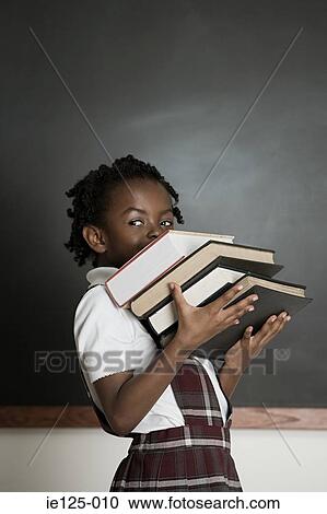 Girl holding books View Large Photo Image Stock Image - Girl holding books. Fotosearch