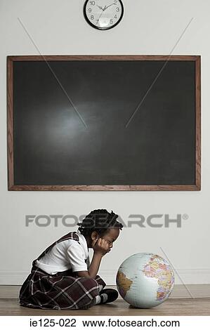 Girl looking at globe View Large Photo Image Stock Image - Girl looking at globe. Fotosearch