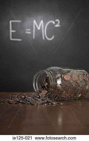 Stock Image - Jar and money in classroom. Fotosearch