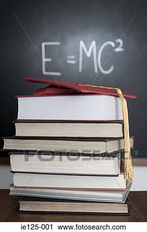 Pile of books and mortarboard View Large Photo Image Stock Image - Pile of books and mortarboard. Fotosearch