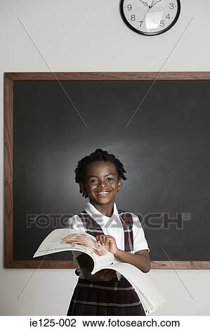 Schoolgirl with book View Large Photo Image Stock Image - Schoolgirl with book. Fotosearch