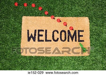 Toy ladybirds and cricket on a welcome mat View Large Photo Image Stock Photo - Toy ladybirds and cricket on a welcome mat. Fotosearch