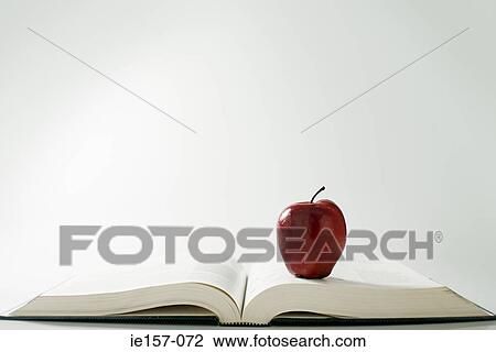 Apple on a book View Large Photo Image Stock Image - Apple on a book. Fotosearch