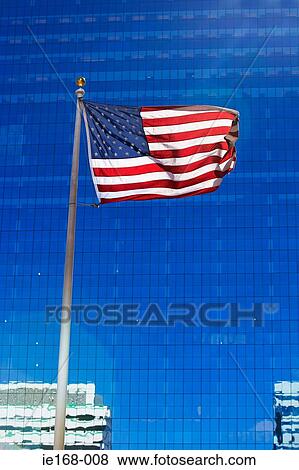 American flag and skyscraper View Large Photo Image Stock Photo - American flag and skyscraper. Fotosearch