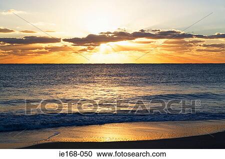 Sunset over the ocean View Large Photo Image Stock Image - Sunset over the ocean. Fotosearch