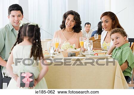 Family and girl with gift View Large Photo Image Stock Image - Family and girl with gift. Fotosearch