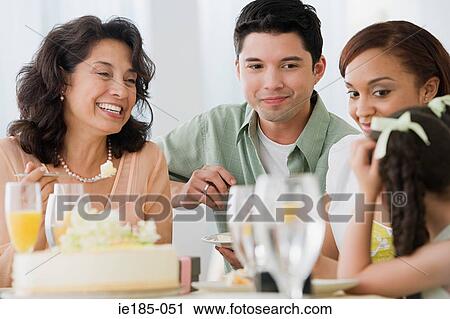 Family at meal View Large Photo Image Stock Image - Family at meal. Fotosearch