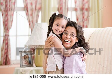 Girl and grandmother hugging View Large Photo Image Stock Photography - Girl and grandmother hugging. Fotosearch