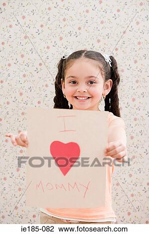 Girl holding a card View Large Photo Image Stock Image - Girl holding a card. Fotosearch