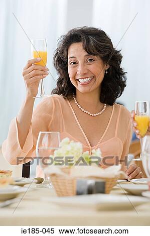 Stock Photography - Woman holding drink. Fotosearch