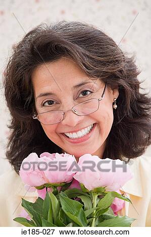Stock Photo - Woman with flowers. Fotosearch