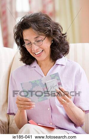 Woman with greetings card View Large Photo Image Stock Image - Woman with greetings card. Fotosearch