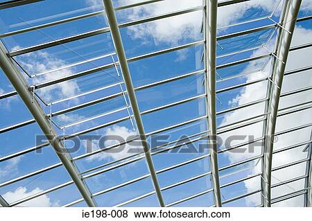 Sky through large greenhouse View Large Photo Image Stock Photo - Sky through large greenhouse. Fotosearch