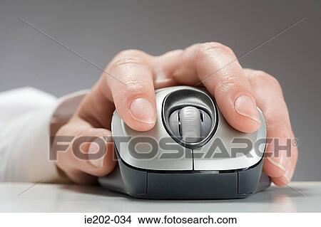 A woman using a computer mouse View Large Photo Image Picture - A woman using a computer mouse. Fotosearch