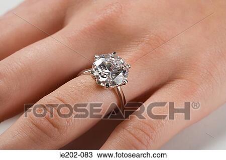A woman wearing an engagement ring View Large Photo Image Stock Image - A woman wearing an engagement ring. Fotosearch