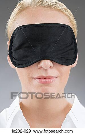A woman wearing an eye mask View Large Photo Image Stock Photo - A woman wearing an eye mask. Fotosearch