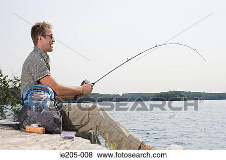 Man fishing in lake View Large Photo Image Stock Photo - Man fishing in lake. Fotosearch
