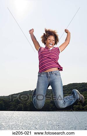 Woman jumping View Large Photo Image Stock Image - Woman jumping. Fotosearch
