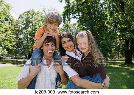 Family in the park View Large Photo Image Stock Photo - Family in the park. Fotosearch