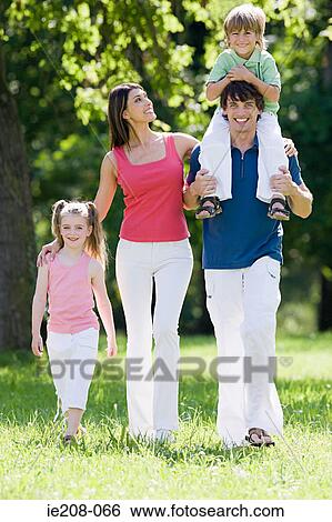 Family in the park View Large Photo Image Stock Photograph - Family in the park. Fotosearch