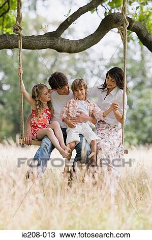 Family on a swing View Large Photo Image Stock Image - Family on a swing. Fotosearch