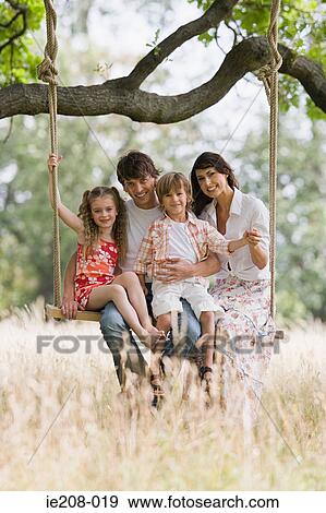 Family on a swing View Large Photo Image Stock Photo - Family on a swing. Fotosearch