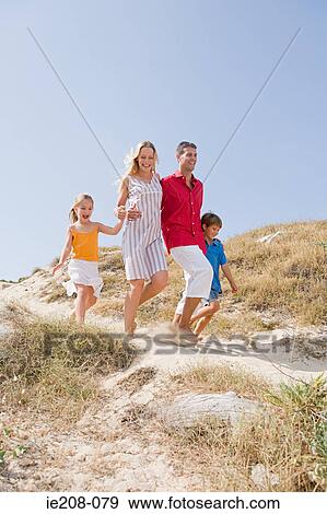 Family running to beach View Large Photo Image Stock Photo - Family running to beach. Fotosearch