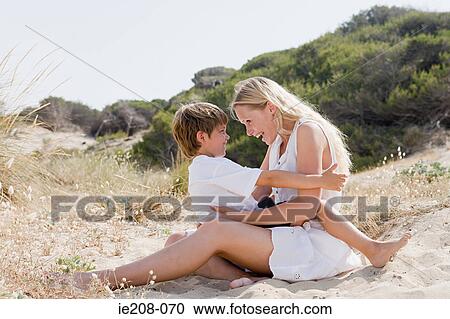 Mother and son on beach View Large Photo Image Stock Image - Mother and son on beach. Fotosearch