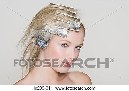 A woman having her hair highlighted View Large Photo Image Stock Image - A woman having her hair highlighted. Fotosearch