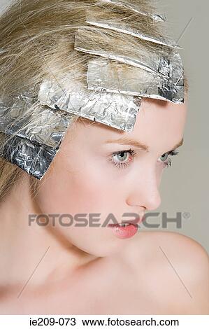 A woman having her hair highlighted View Large Photo Image Stock Image - A woman having her hair highlighted. Fotosearch