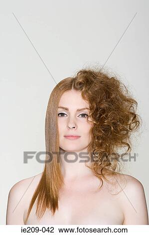 Stock Image - A woman with straight and curly hair. Fotosearch