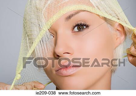 Stock Photo - Portrait of a woman wearing a hairnet. Fotosearch