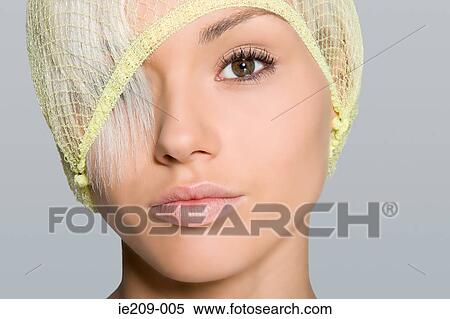 Stock Photography - Portrait of a woman wearing a hairnet. Fotosearch