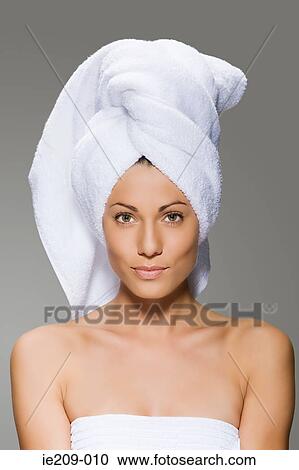 Stock Image - Portrait of a woman wearing a towel. Fotosearch
