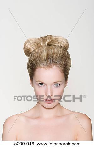 Stock Photograph - Portrait of a woman with a hairstyle. Fotosearch