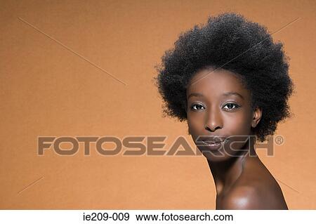 Stock Photo - Portrait of a woman with afro hair. Fotosearch