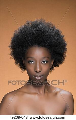 Stock Photo - Portrait of a woman with afro hair. Fotosearch