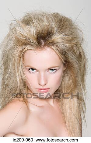 Stock Image - Portrait of a woman with backcombed hair. Fotosearch