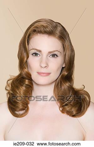 Stock Image - Portrait of a woman with ginger hair. Fotosearch