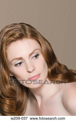 Stock Photo - Portrait of a woman with ginger hair. Fotosearch